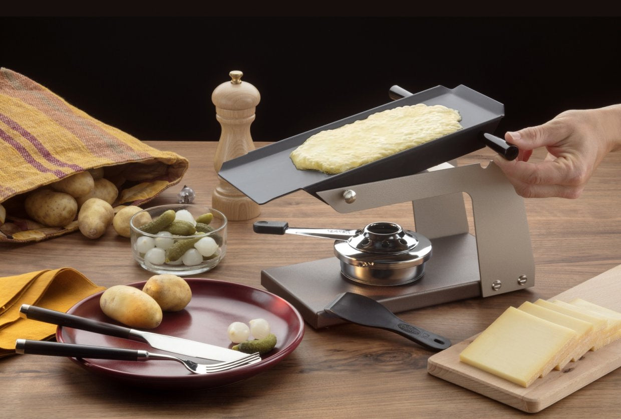 TTM Raclette Racly 100.021 – 2 Käsehälften, Aluminiumplatte – schwarz/braun