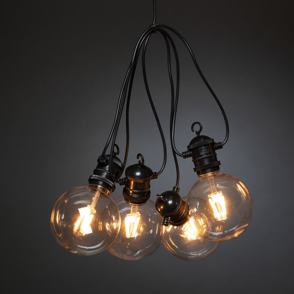 Konstsmide Lichterkette – 14,5 m – 46 lm, 7 W – Bernstein, 1800 K – IP44 – Solarbetrieb – Schwarz, Kunststoff