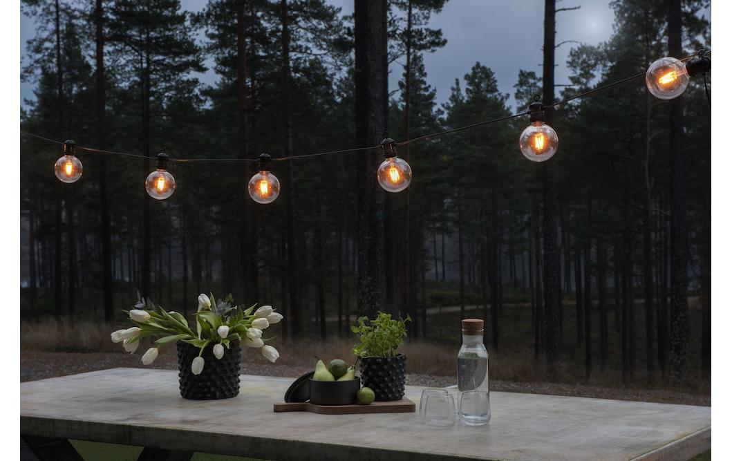 Konstsmide Lichterkette 9,15 m – Bernstein, 10 LEDs, dimmbar, IP44 – 1 Stk., Schwarz/Transparent – 2395-800