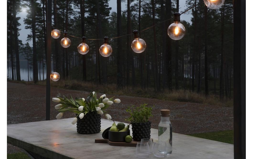 Konstsmide Lichterkette 9,15 m – Bernstein, 10 LEDs, dimmbar, IP44 – 1 Stk., Schwarz/Transparent – 2395-800