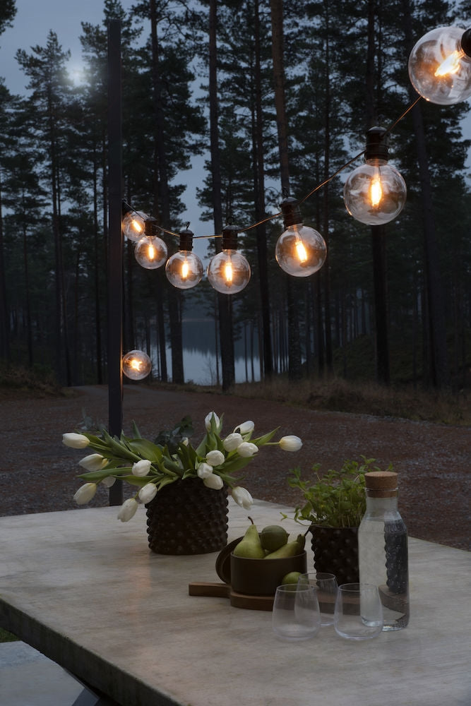 Konstsmide Lichterkette 9,15 m – Bernstein, 10 LEDs, dimmbar, IP44 – 1 Stk., Schwarz/Transparent – 2395-800
