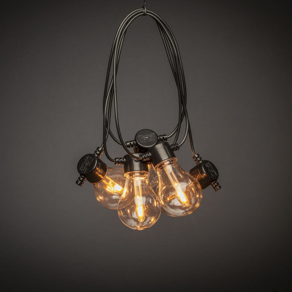 Konstsmide Solar-Lichterkette – Bernstein, 1800 K – IP44 – Timer, dimmbar, Fernbedienung – Schwarz, Kunststoff
