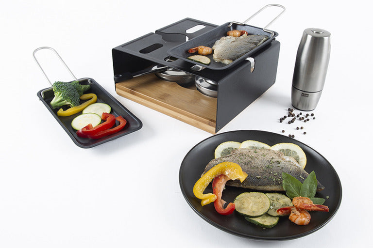 Stöckli Raclette-Grill Multifun – 2 Pastenbrenner, teflonbeschichtet, Metall/Bambusholz – Schwarz/Holz