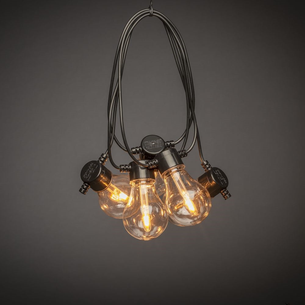 Konstsmide Lichterkette – 4,5 m – 10 LEDs – Bernstein – Netzbetrieb – IP55 – dimmbar – Schwarz – Kunststoff