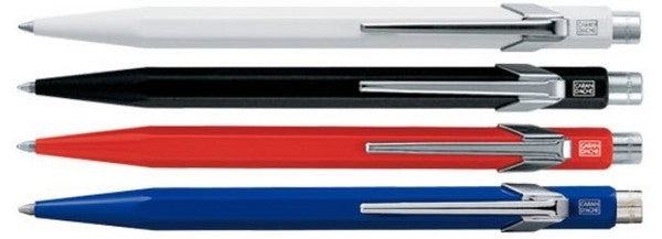 Caran d-Ache Caran d'Ache 849 Kugelschreiber – Blau, Schaft Rot/Blau/Schwarz/Weiss, Druckmechanik, Leichtmetall-Schaft, nachfüllbar
