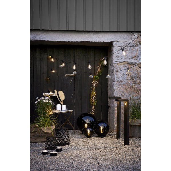 Star Trading LED-Teelicht Maxi – Ø 10 cm – Warmweiss – Batteriebetrieben – Timer 6/18 h, flackernd – Schwarz